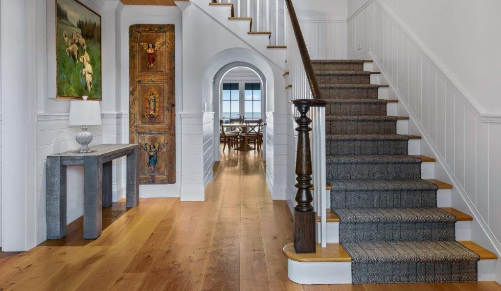 Hallway With Staircase And Painting