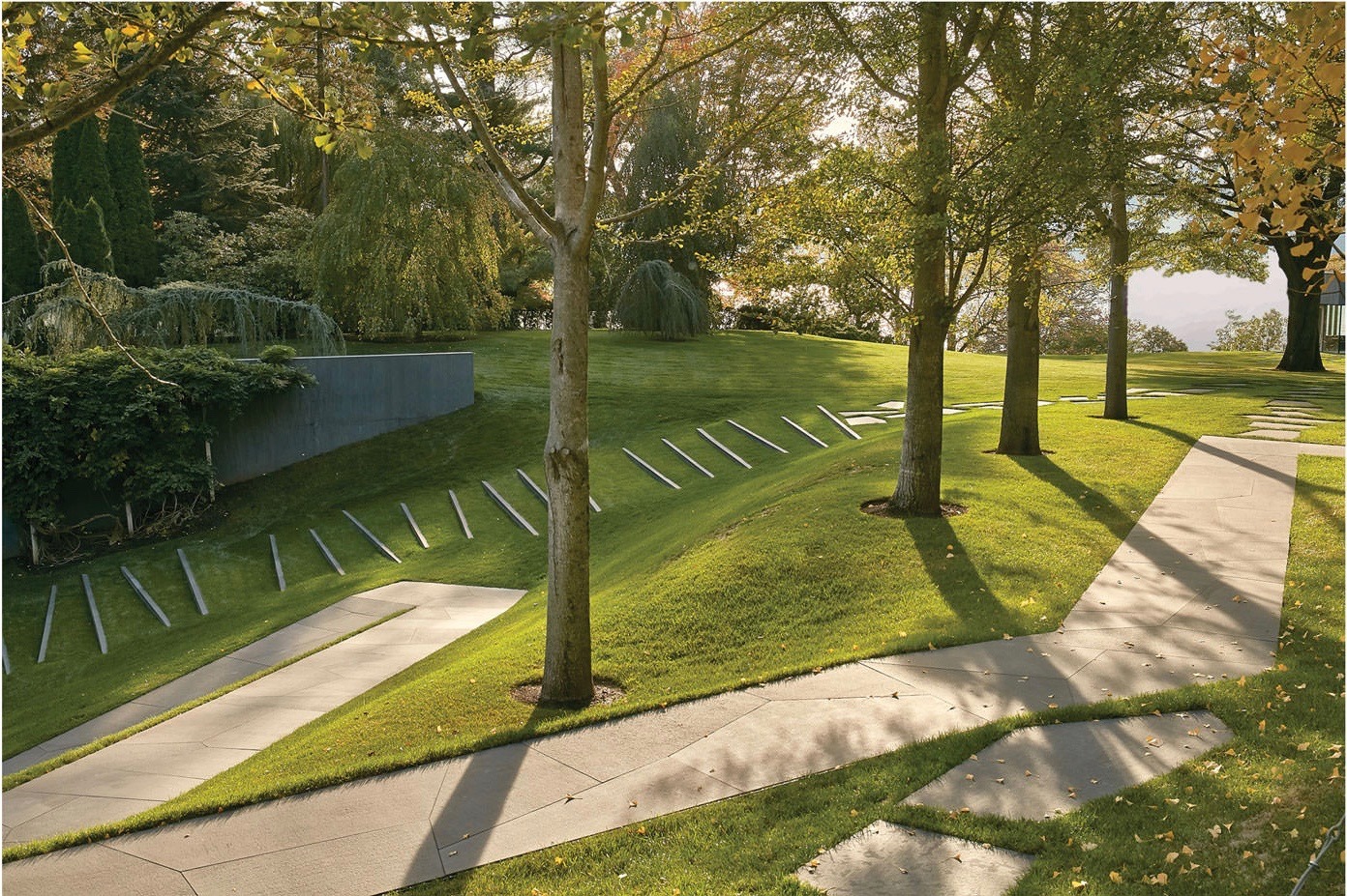 A Serene Pathway Meandering Through A Lush Green Field