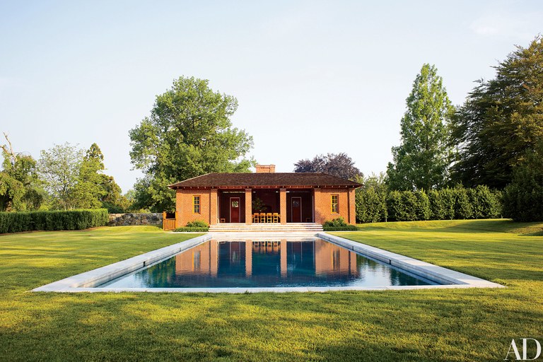 A Serene Pool Nestled Amidst A Vibrant, Green Lawn.