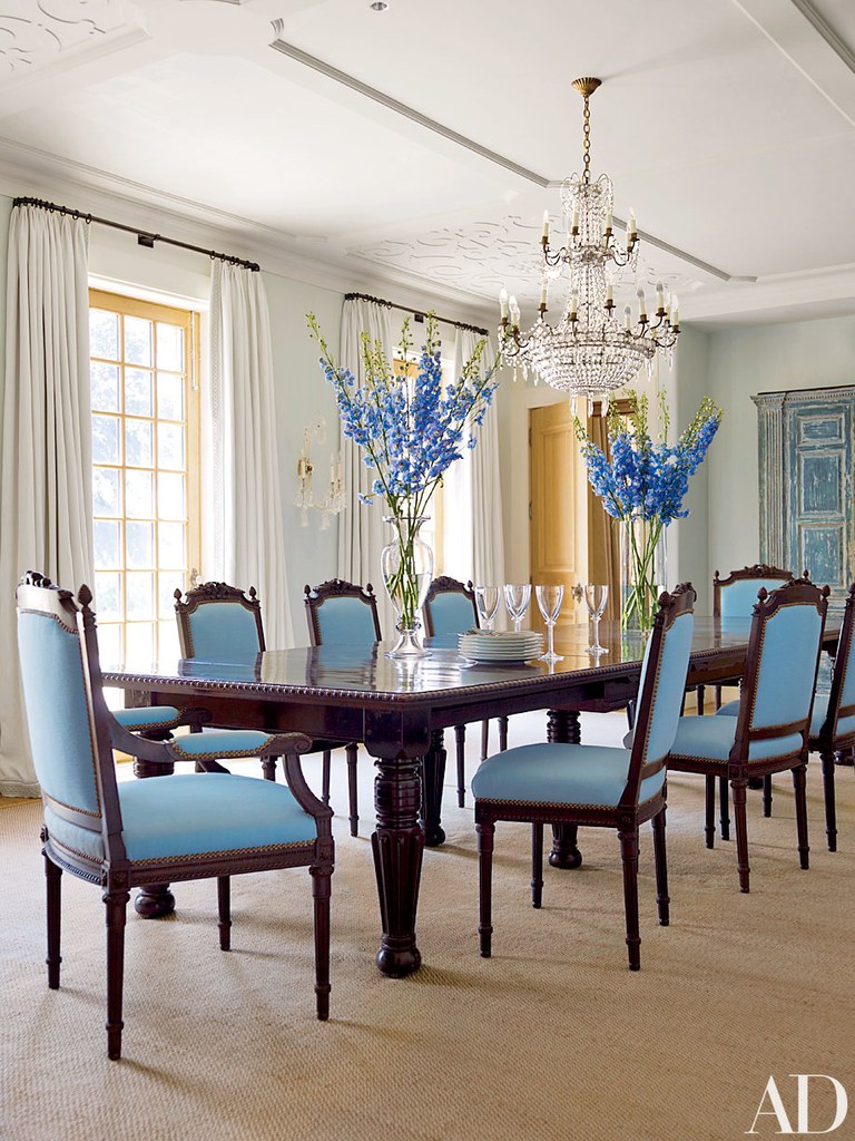A Formal Dining Room Adorned With Blue Chairs